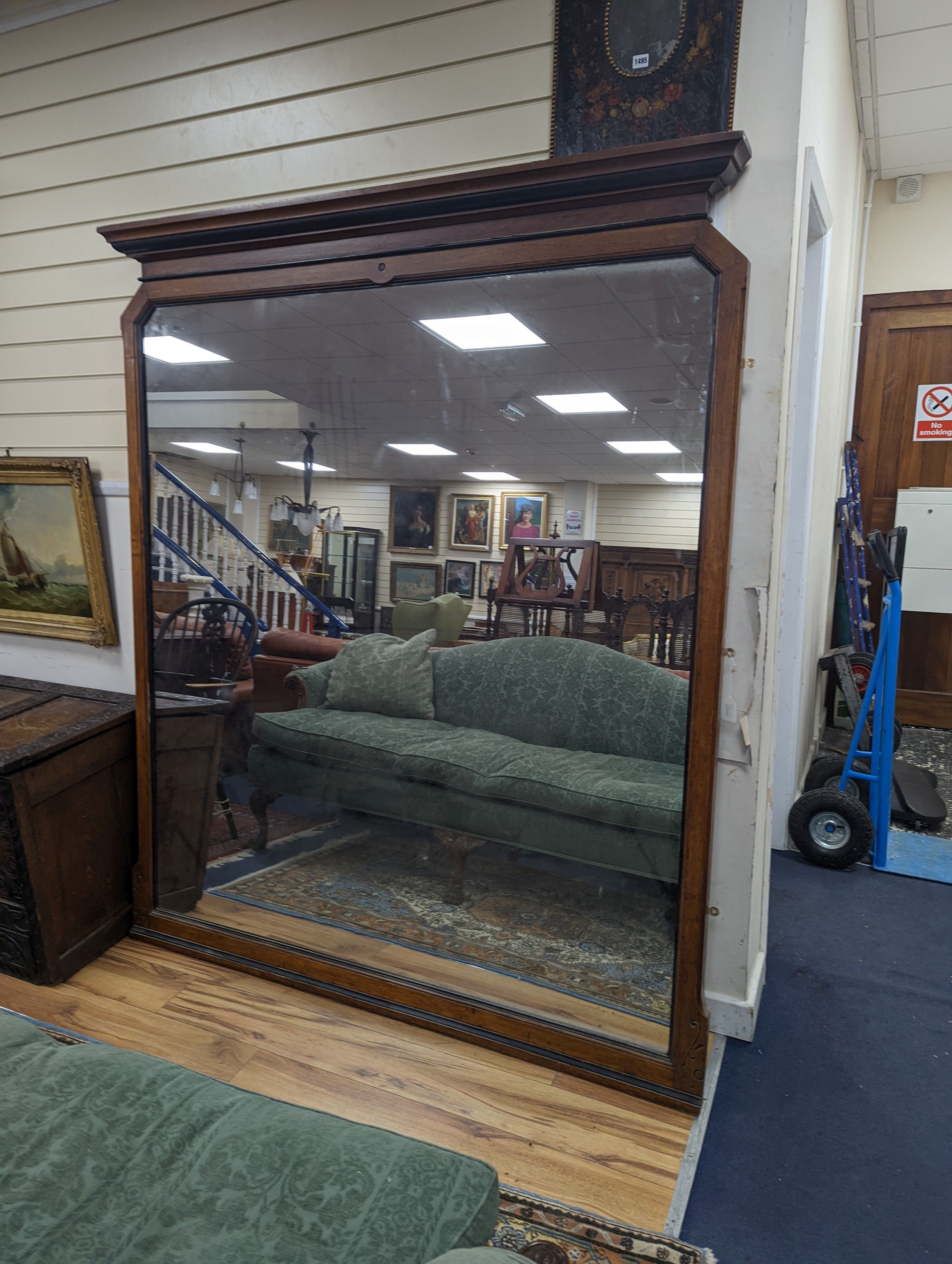 A large late Victorian aesthetic movement part ebonised oak overmantel mirror, width 162cm, height 197cm